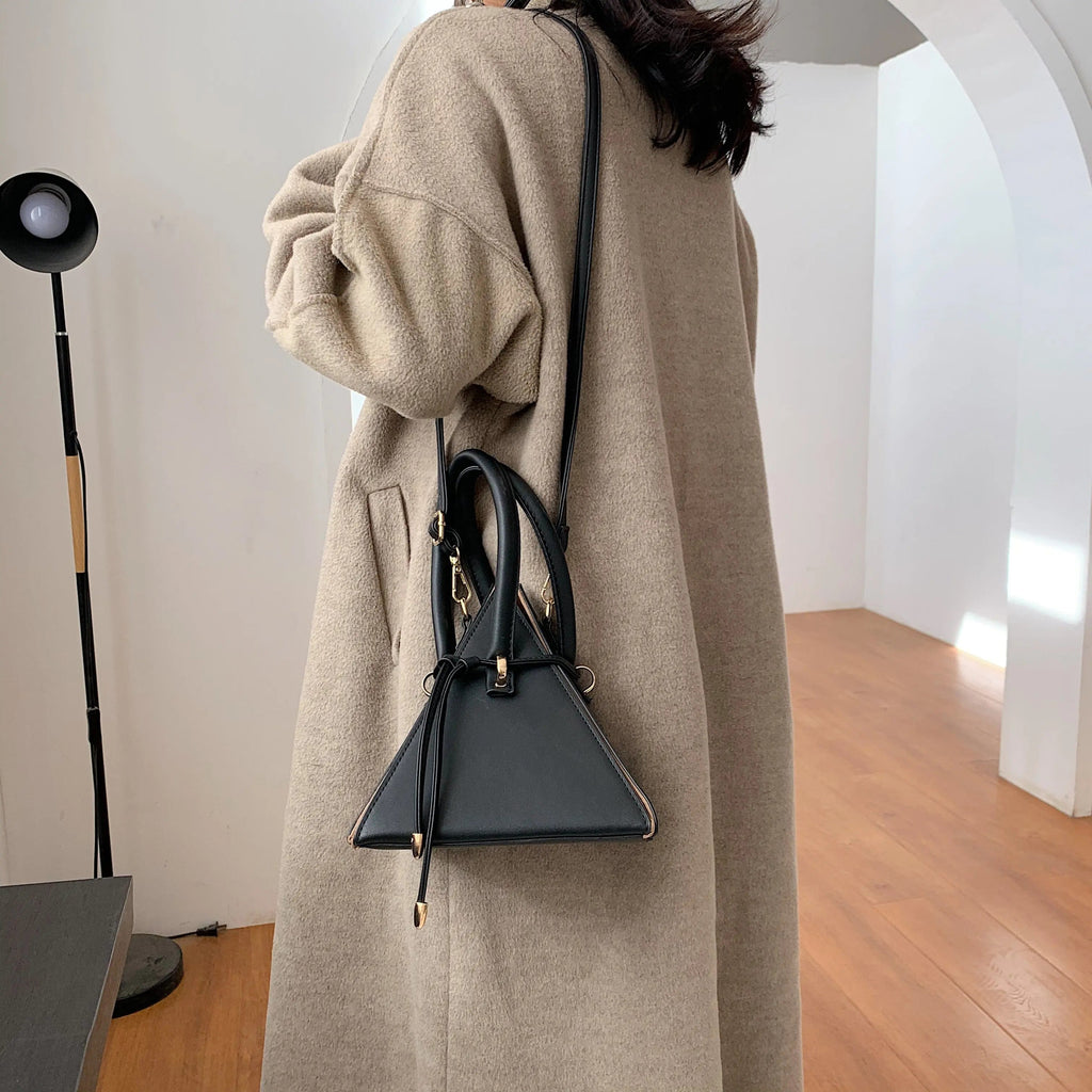 Chonghui women's triangle chain bucket bag made of PU leather, crossbody style with chain strap, stylish designer handbag for women