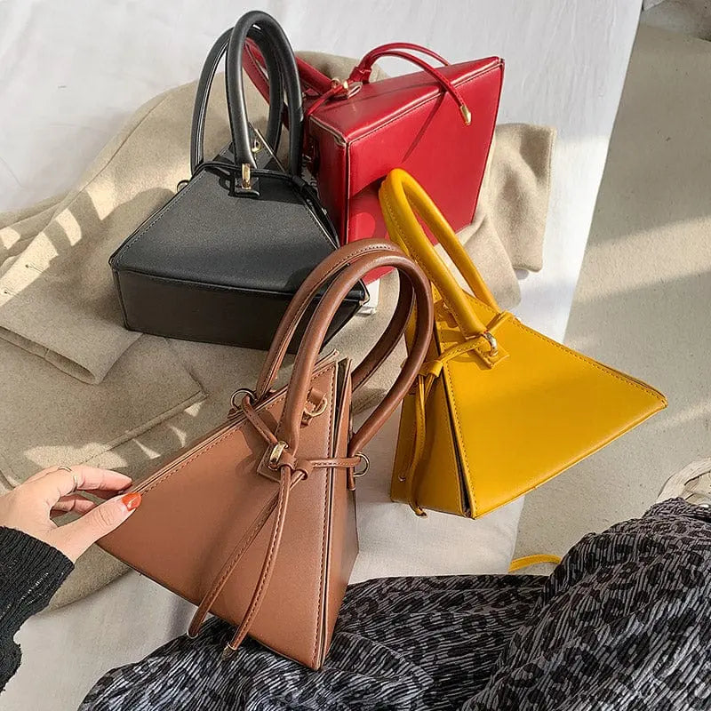 Chonghui women's triangle chain bucket bag made of PU leather with crossbody strap, stylish designer handbag for women