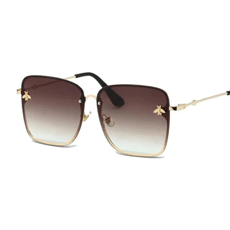 Square fashion sunglasses with UV400 mirror lenses and alloy frames worn by a woman, stylish and high-quality designer eyewear.