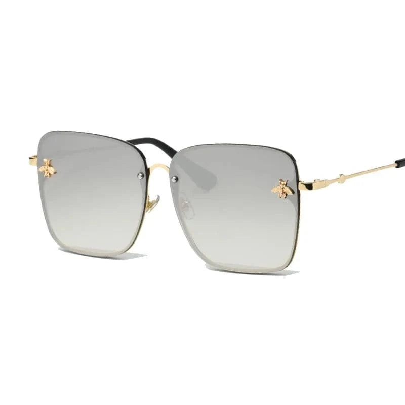 Square fashion sunglasses with UV400 mirror lenses and alloy frame, worn by a woman in a luxury designer style.