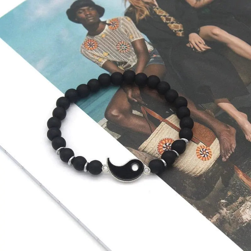 Matching Yin Yang friendship bracelets with adjustable cords, featuring black and white design, symbolizing balance and unity.