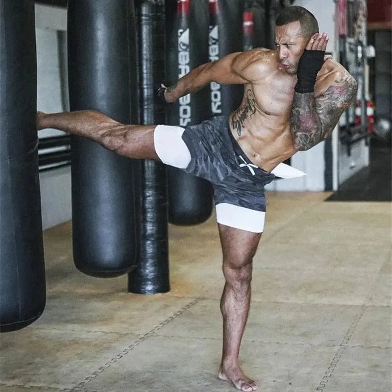 Men's 2-in-1 running shorts by Showlu Fashion with double deck design, ideal for gym, fitness, and outdoor jogging.