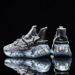 Displayed against a black background, the 2022 Top Sale Fashion Sneaker features breathable grey mesh uppers and thick light blue soles with a black, white, and yellow marbled pattern for a bold, stylish look.