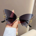 Elegant diamond butterfly sunglasses by Showlu Fashion with square frames, UV-proof lenses, perfect for fashionable street style.