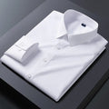 Slim fit white stretch dress shirt for men with anti-wrinkle fabric, long sleeves, and a sleek business style.