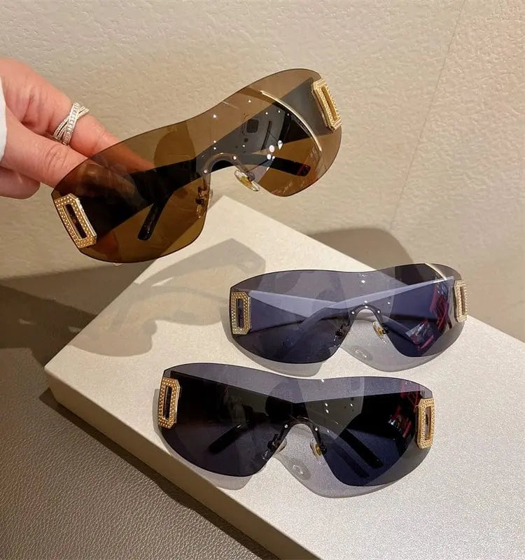 Showlu Fashion Women's large frameless square sunglasses with UV400 protection, stylish one-piece design and clear lens details.