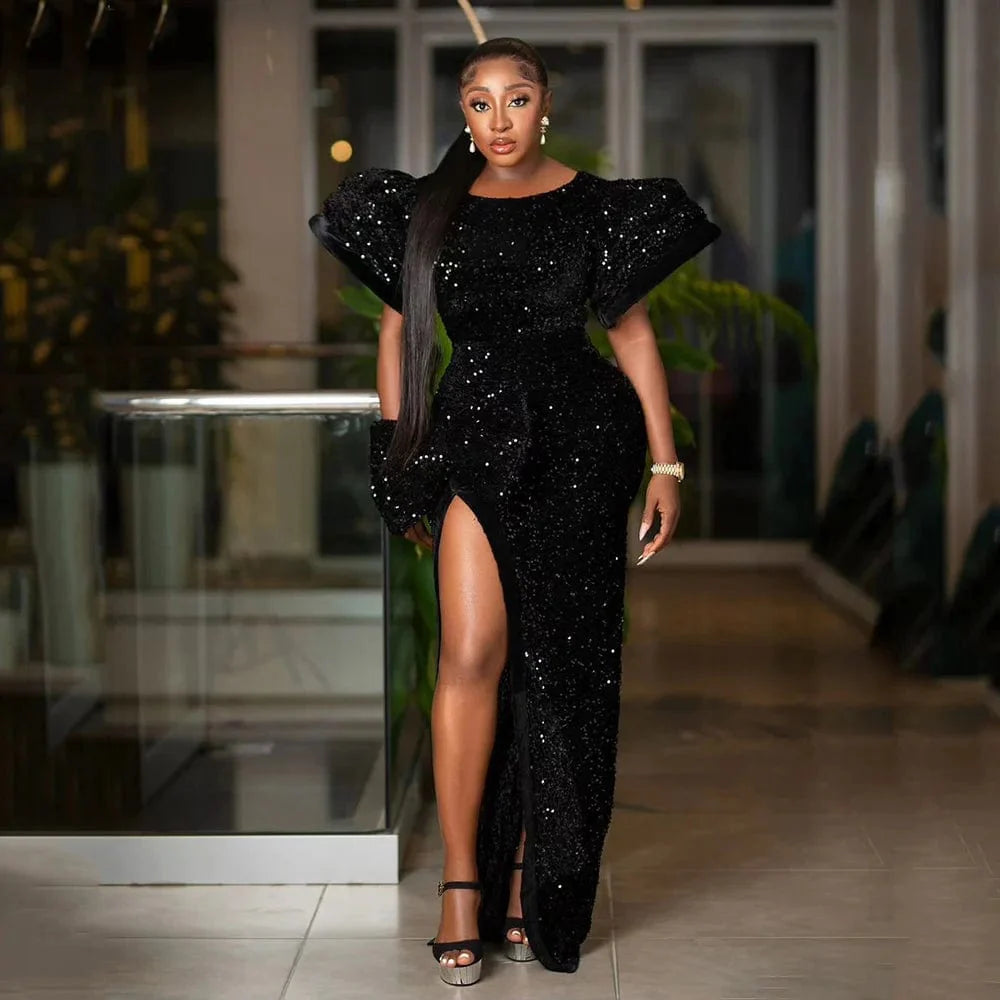 Black sequin evening dress by SHOWLU FASHION STORE featuring puffed sleeves, high slit, round neck, and fishtail floor-length design.