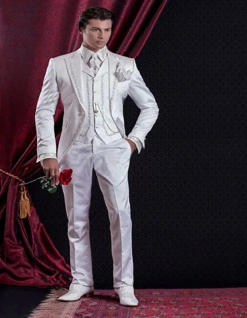 White embroidery men's 3-piece wedding suit with slim fit tuxedo jacket, pants, and vest, perfect for grooms and formal occasions.