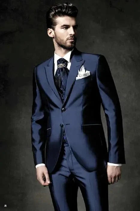 Navy blue Showlu Fashion groom tuxedo with peak lapel, slim fit jacket, pants, and vest for wedding or formal event.
