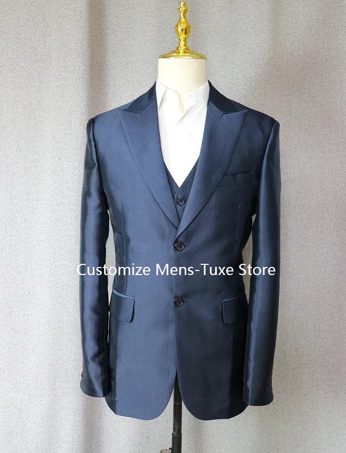 Navy blue Showlu Fashion groom tuxedo with peak lapel, slim fit, including jacket, pants, and vest for wedding or prom attire.