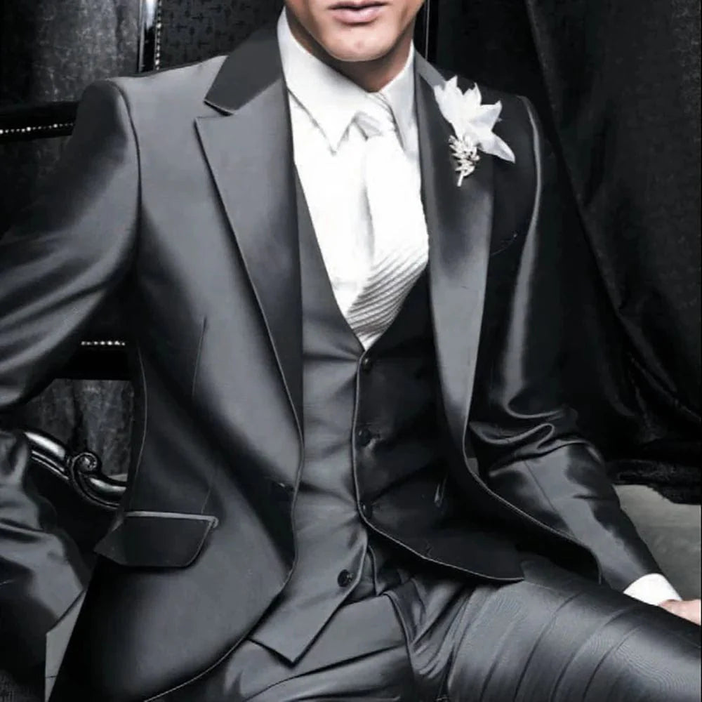 Navy blue Showlu Fashion groom tuxedo with peak lapel, slim fit jacket, pants, and vest for wedding or formal occasion.