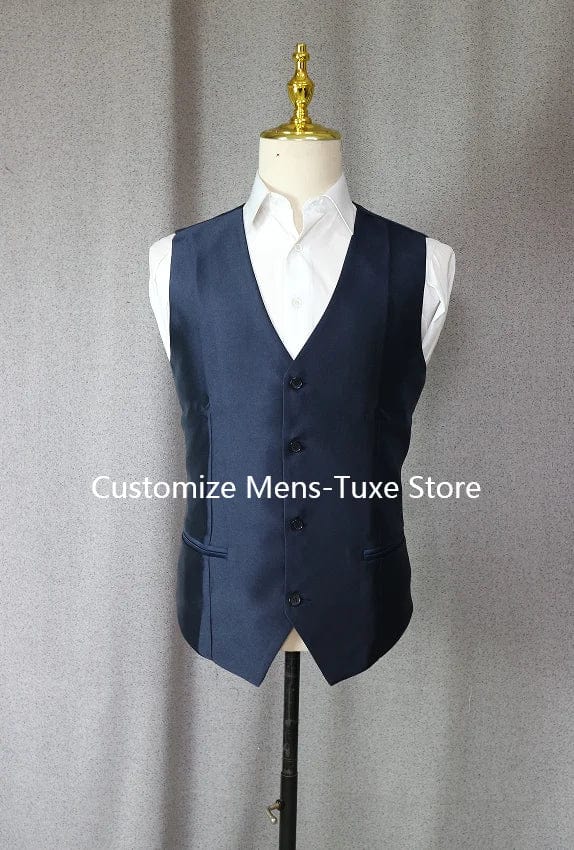 Navy blue Showlu 3-piece groom tuxedo with peak lapel, slim fit, jacket, pants, and vest for wedding or formal occasion.