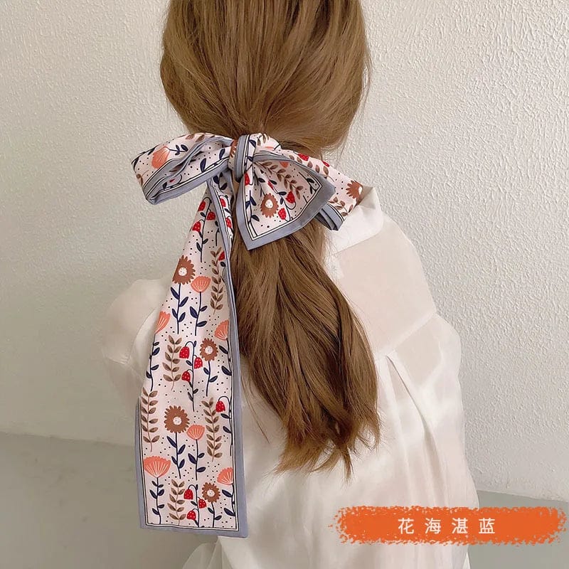 Showlu Silk Scarf Hair Band with long ribbon bow, letter print design, perfect for women's ponytail and hair accessory styling.