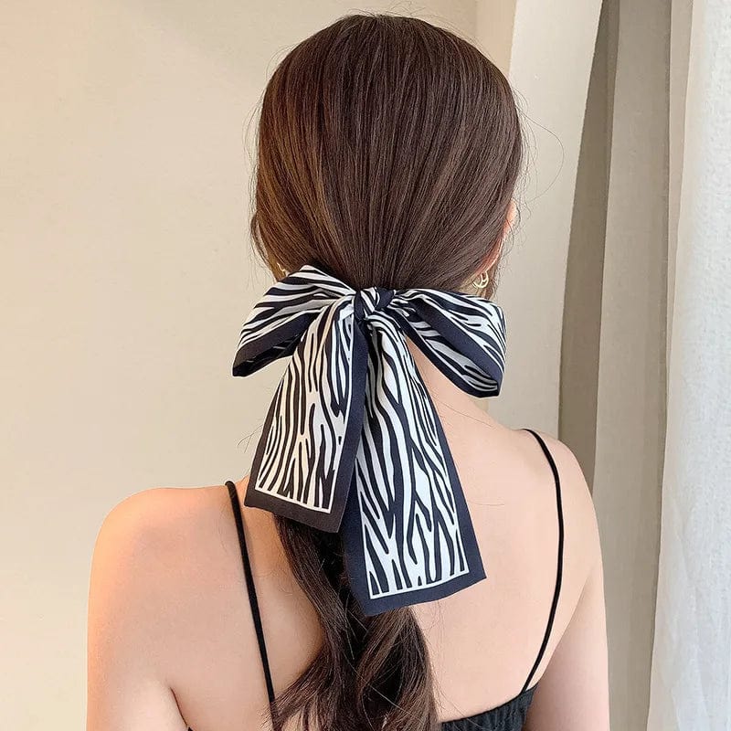 Showlu Silk Scarf Hair Band with letter print and long ribbon bow, stylish women's hair accessory for ponytails and hair styling.