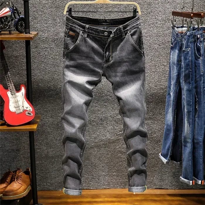 Showlu Men's skinny fit denim jeans with zipper fly, blue stretch slim pencil pants, casual style, front view.
