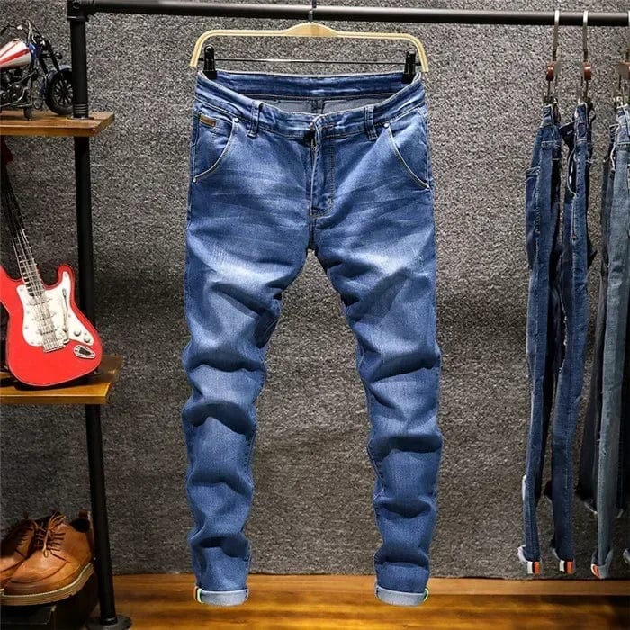 Showlu Men's skinny fit denim jeans with zipper fly in blue, featuring a slim, stretch design and casual style.