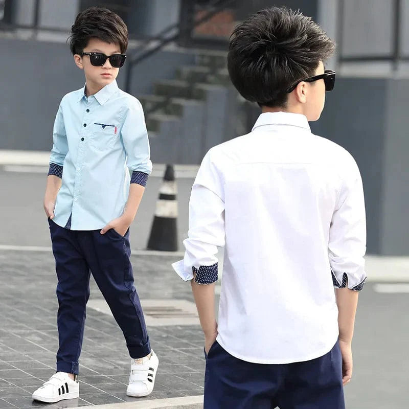 Boy wearing Showlu Fashion plaid cotton long sleeve shirt, casual school top for kids aged 5 to 15, in a stylish design.