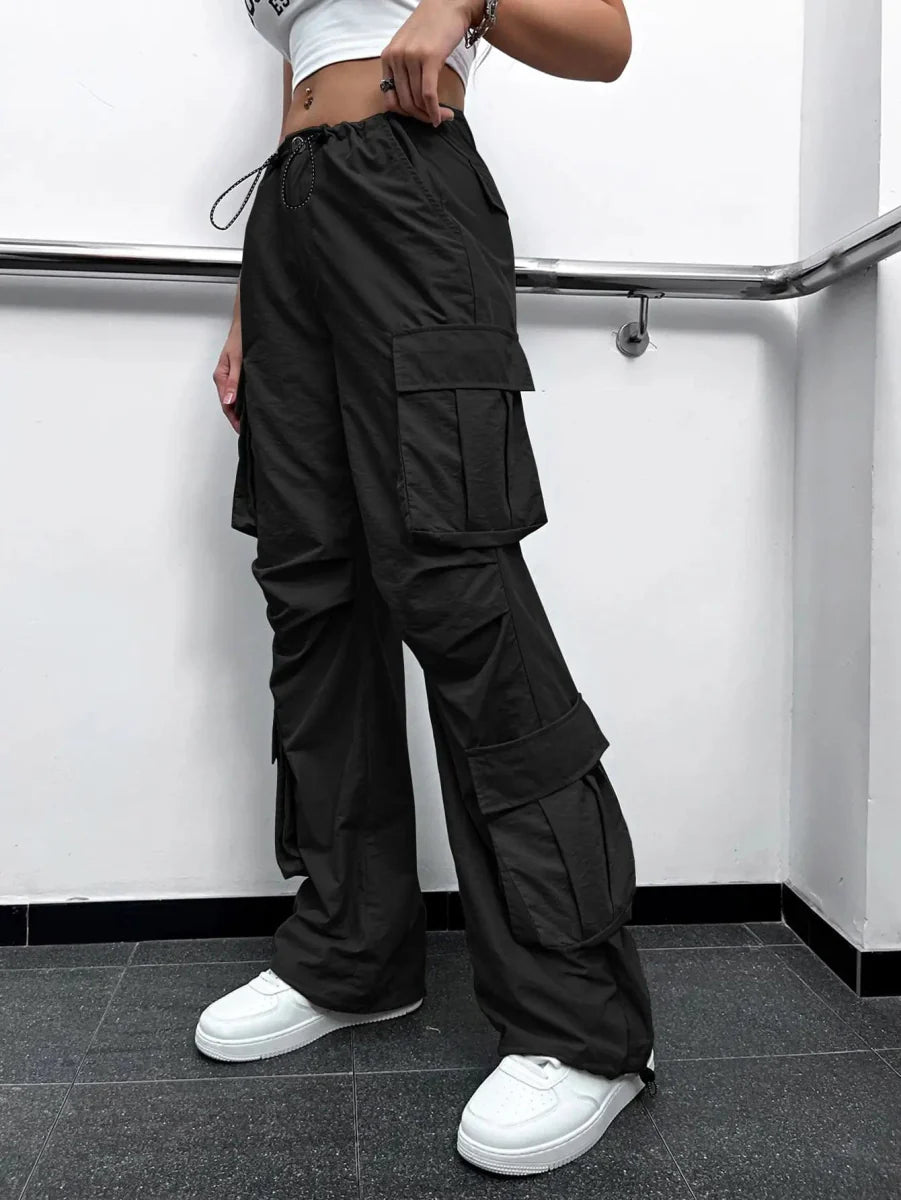 Showlu Women's high waist cargo parachute pants with flap pockets, wide-leg style, drawstring waist, and ruched details.