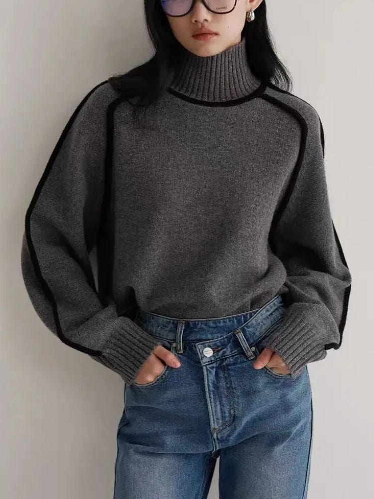 Women's knitted hoodie with turtleneck, lantern sleeves, and splicing design, perfect for autumn and winter wear.