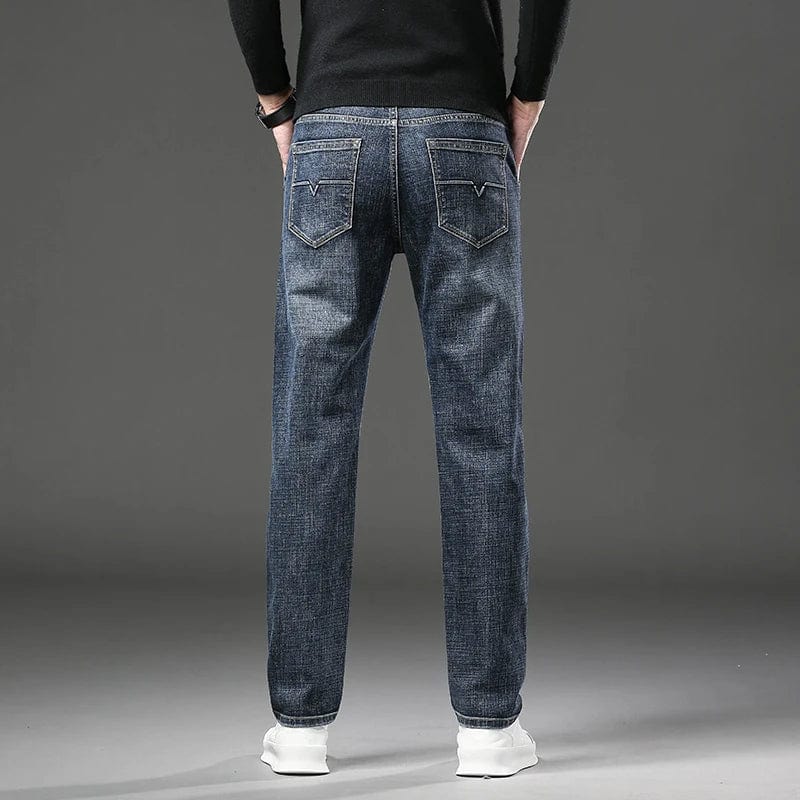 Men's straight leg stretch denim jeans by Showlu Fashion, casual spring style with soft, baggy fit and classic denim texture.