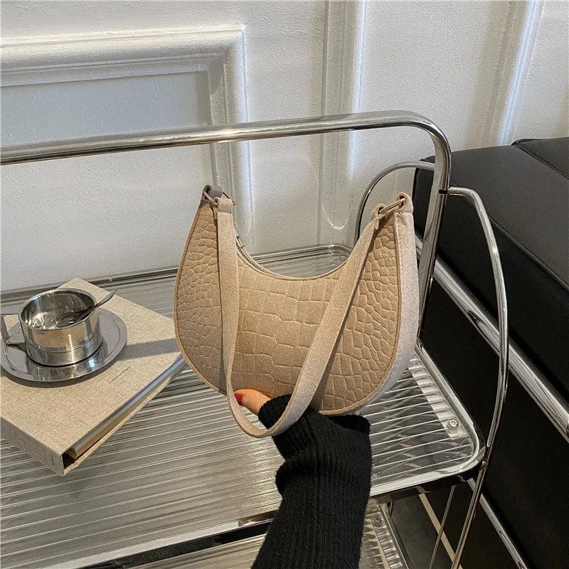 SHOWLU FASHION women's felt alligator pattern shoulder bag featuring a small handle, underarm design, and crescent shape.