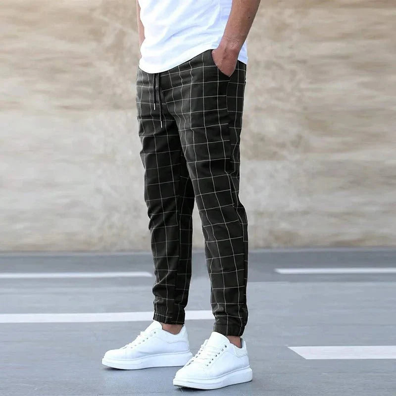 Men's plaid slim fit sweatpants by Showlu Fashion with side stripes, mid-waist design, casual and summer-ready trousers.