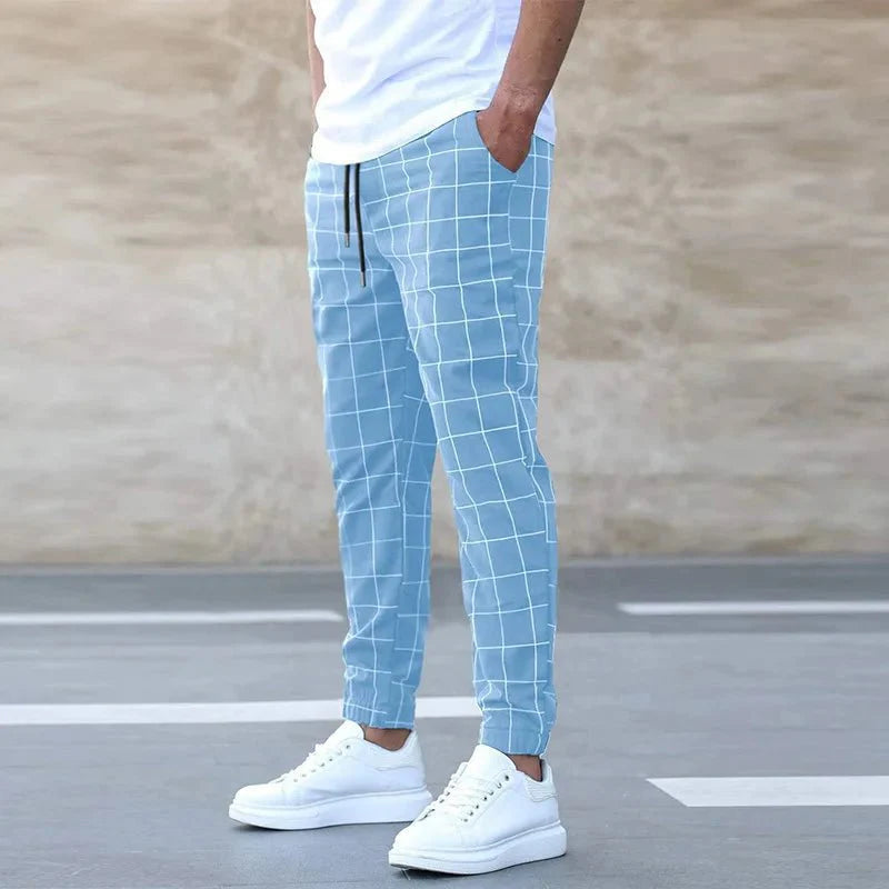 Men's plaid slim fit sweatpants with side stripe detail, mid-waist design, casual and summer-ready trousers from Showlu Fashion.