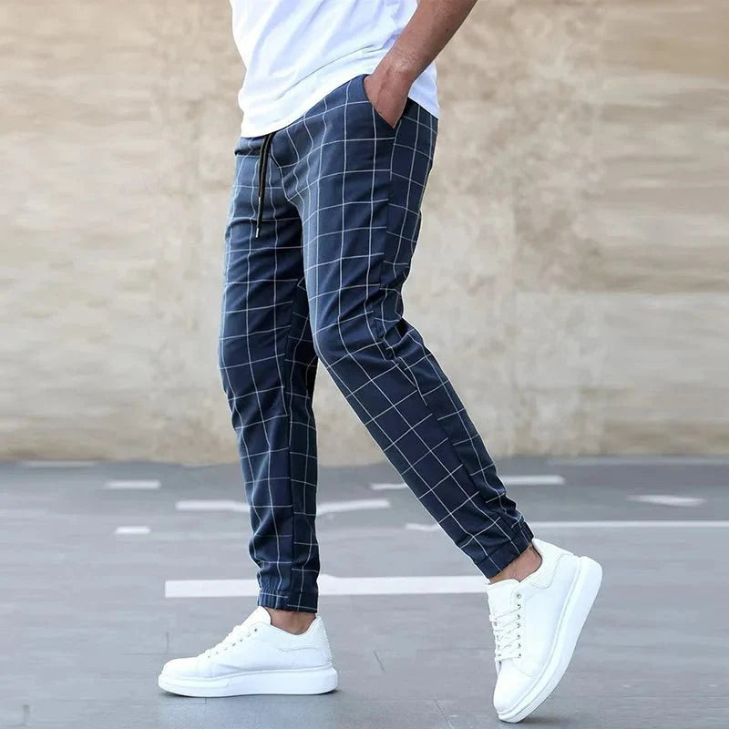 Men's plaid slim fit sweatpants with side stripe detail, mid-waist design, casual summer trousers by Showlu Fashion.