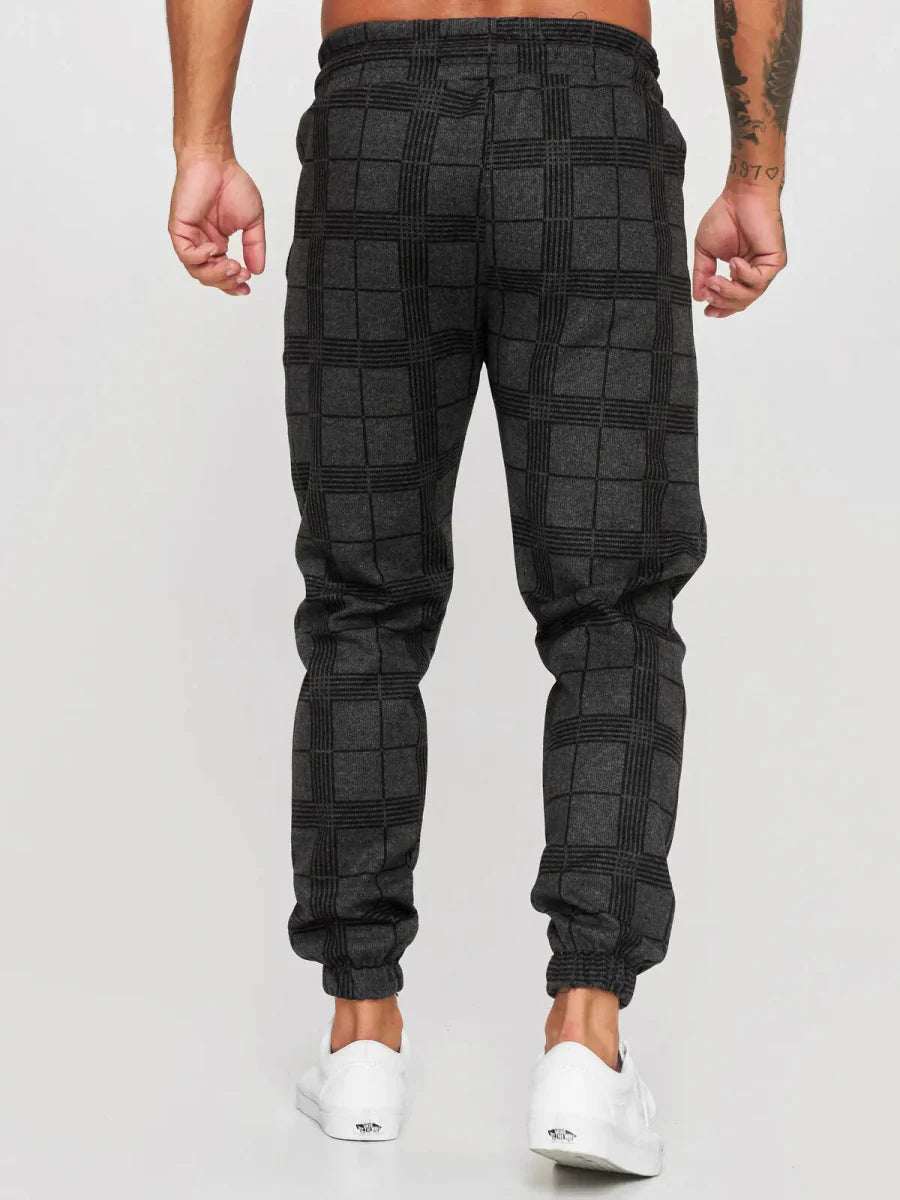 Men's plaid slim fit sweatpants with side stripes, mid-waist design, casual and summer-ready trousers by Showlu Fashion.