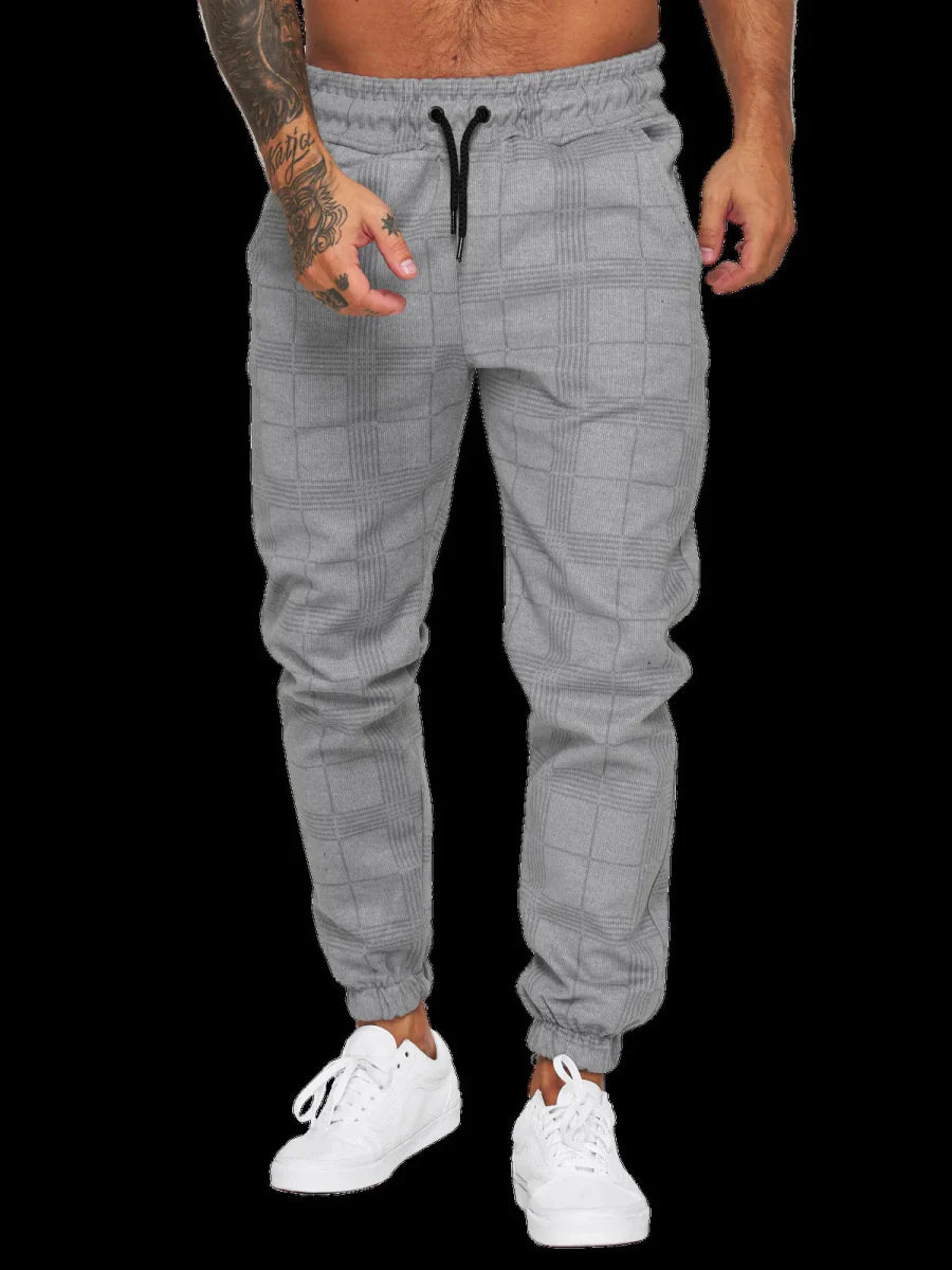 Men's plaid slim fit sweatpants with side stripe detailing, mid-waist design, casual summer trousers by Showlu Fashion.