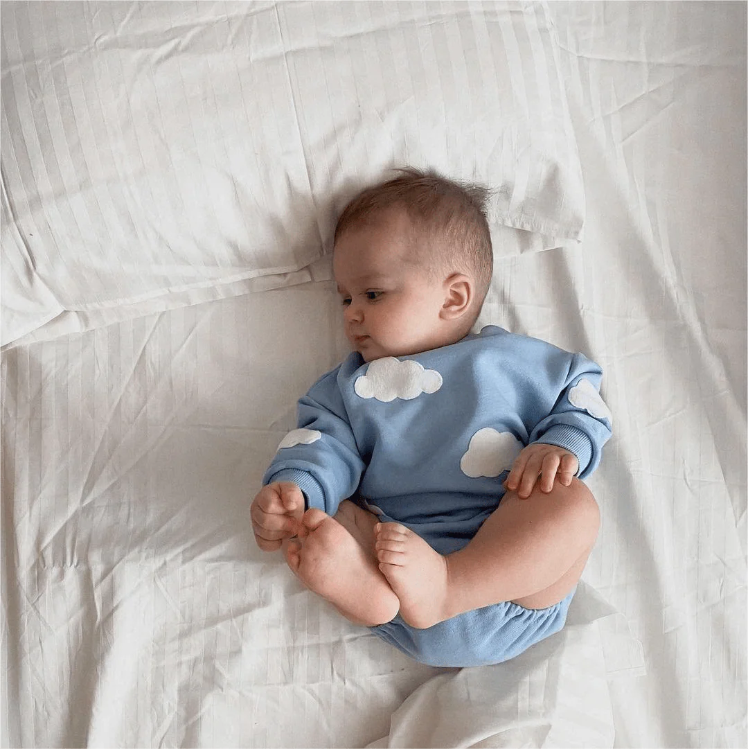 Showlu unisex baby cotton romper with cute cloud pattern, short sleeves, and color splicing design for newborns and babies.