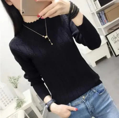 Women's cashmere knit sweater with slim fit turtleneck and half-high collar, shown in a short, stylish pullover design for autumn and winter.
