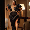 Black V-neck mermaid prom dress with feather and pearl embellishments, designed for formal events and special occasions.