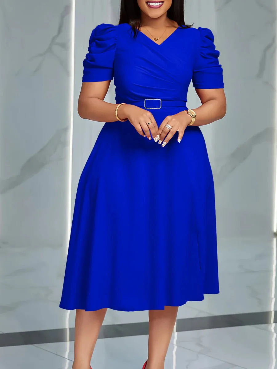 Elegant women's V-neck pleated A-line summer dress with short puff sleeves, styled for a fashionable, summery look.