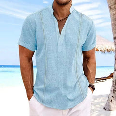 A light blue short-sleeve cotton linen shirt with a stand collar and vertical decorative trim.