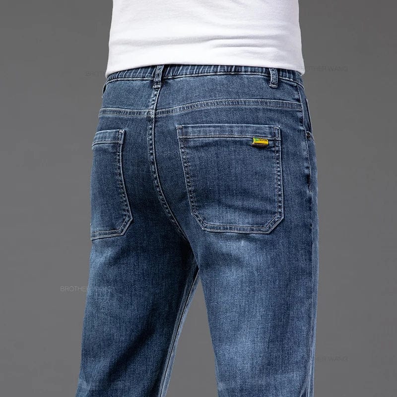 Brother Wang men's summer thin straight-leg jeans in lightweight denim with elastic waist, casual and comfortable fit.