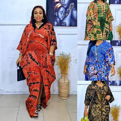 A woman models a long, hooded polyester kaftan dress featuring a tie-dye pattern in four colors.