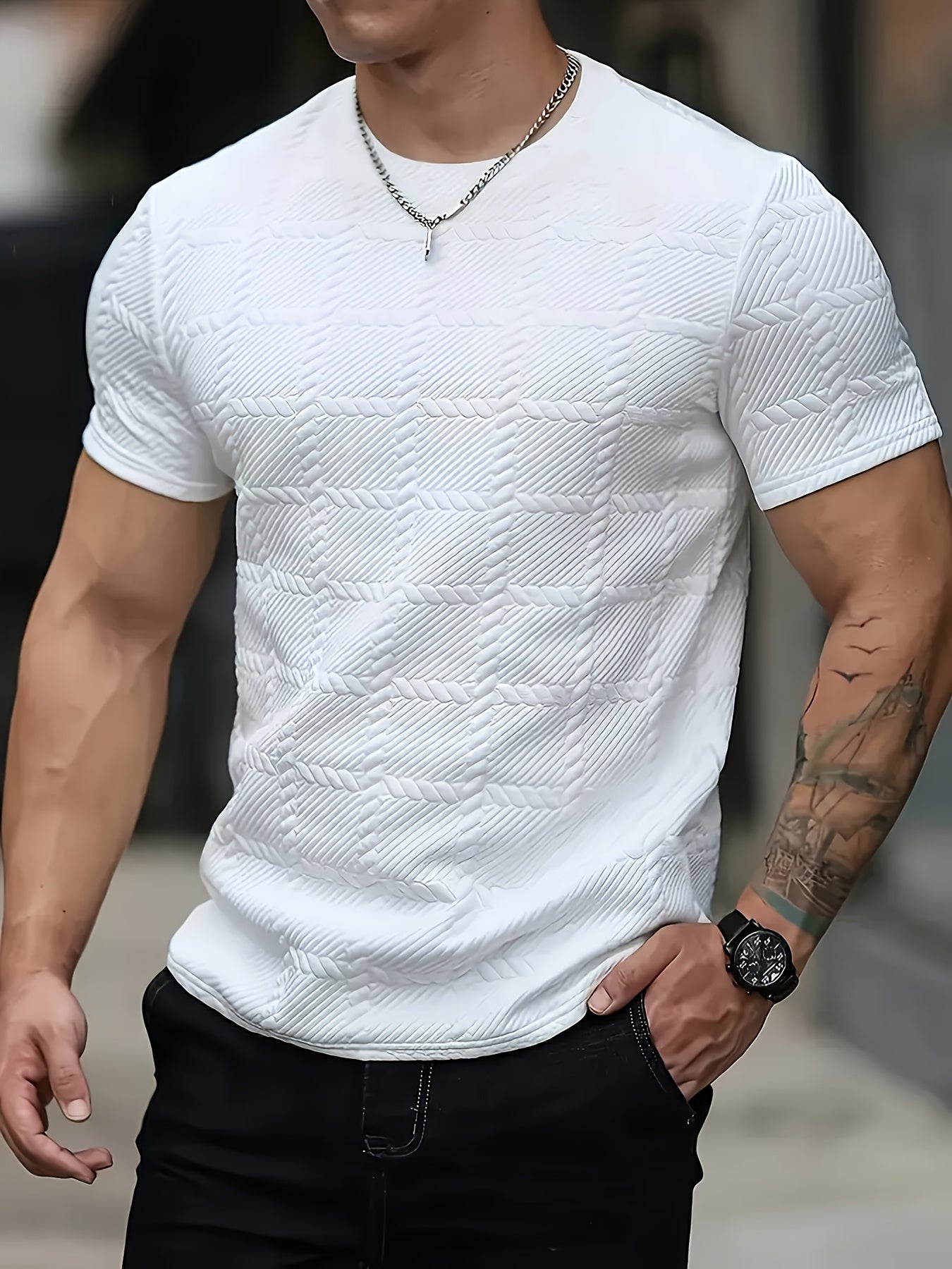 Men's SHOWLU geometric jacquard knit t-shirt with casual round neck, featuring a detailed pattern and comfortable fit.