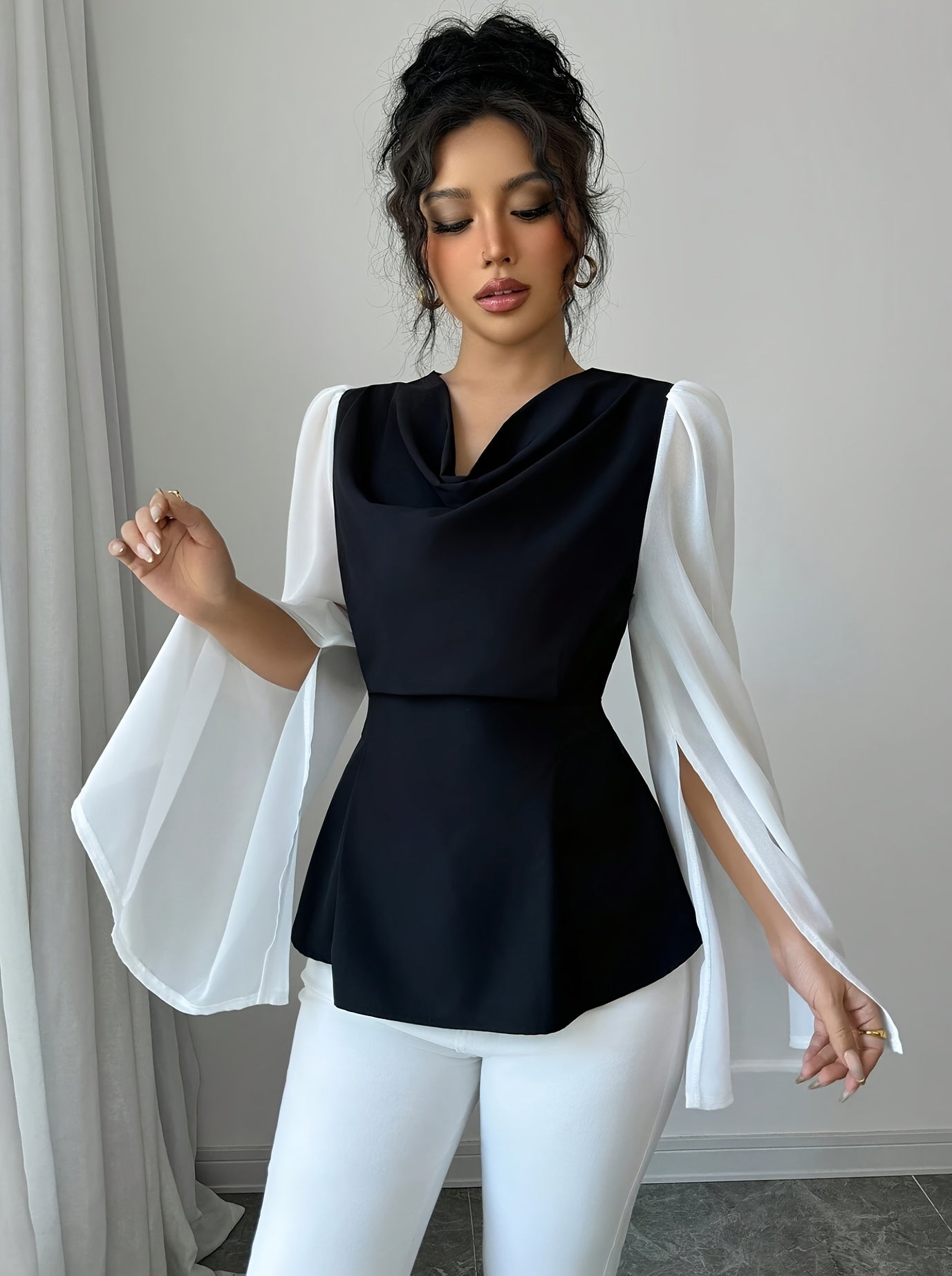 Black and white pleated asymmetrical long sleeve blouse for women by SHOWLU FASHION STORE, featuring stylish pleats and unique design.