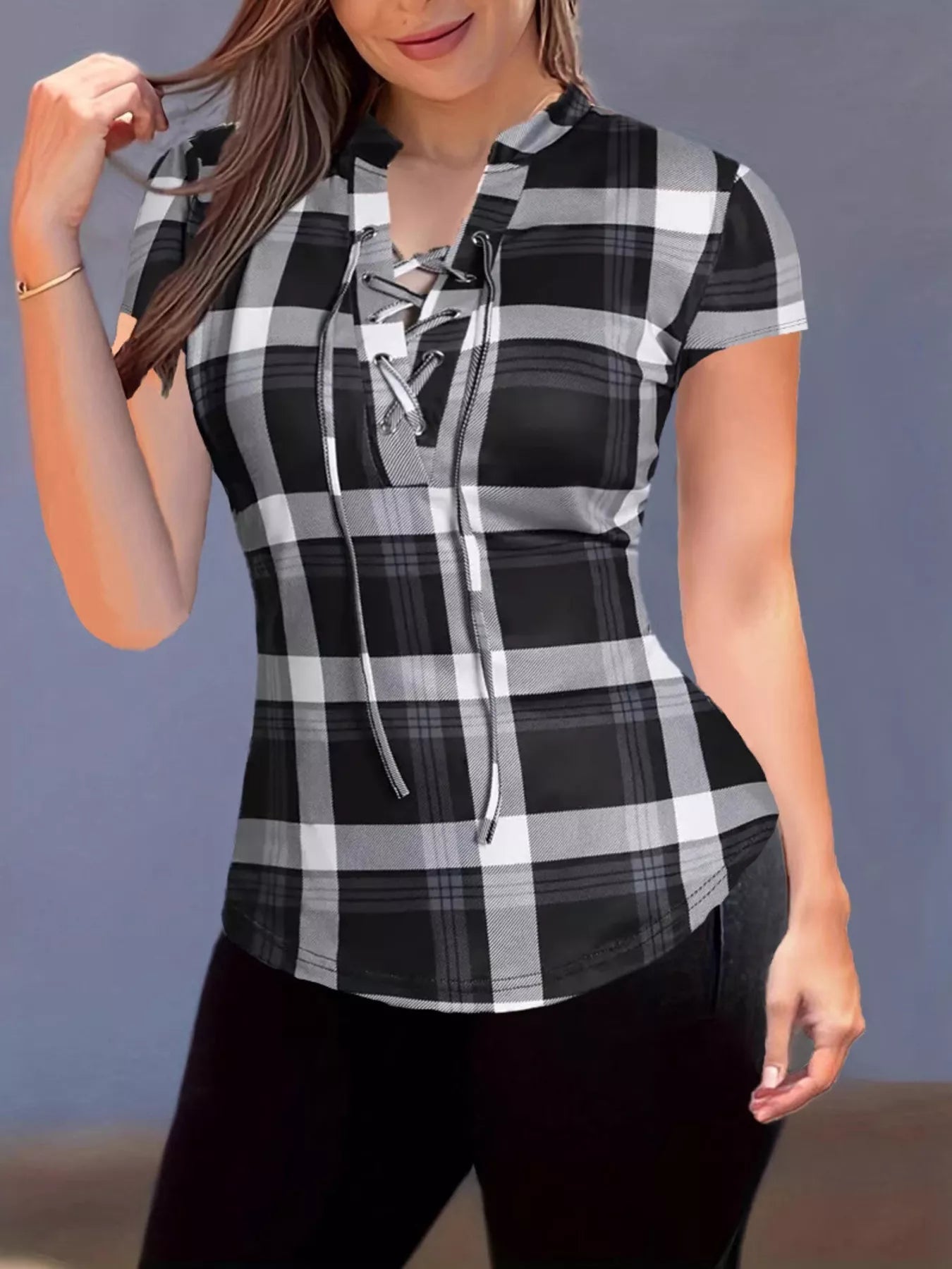 Plaid lace-up short sleeve blouse from Trendsi featuring a stylish pattern and casual fit, shown on a model.