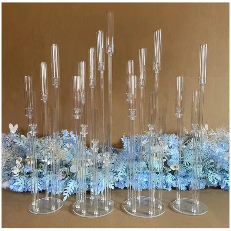Set of clear acrylic MS Made candlestick holders for weddings and events, used as elegant centerpieces and wedding decorations.