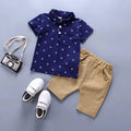 Showlu Boys 2-piece cotton summer set with anchor print shorts and tee, perfect for toddlers' warm-weather casual wear.