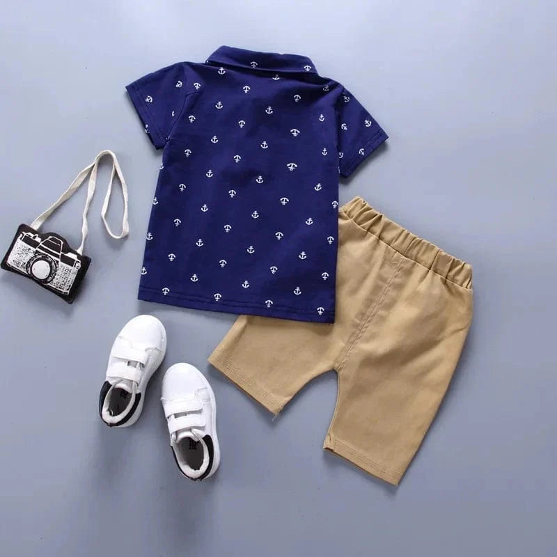 Showlu Boys 2-piece cotton summer set with anchor print shorts and tee for toddlers, featuring cute boat pattern and casual style.