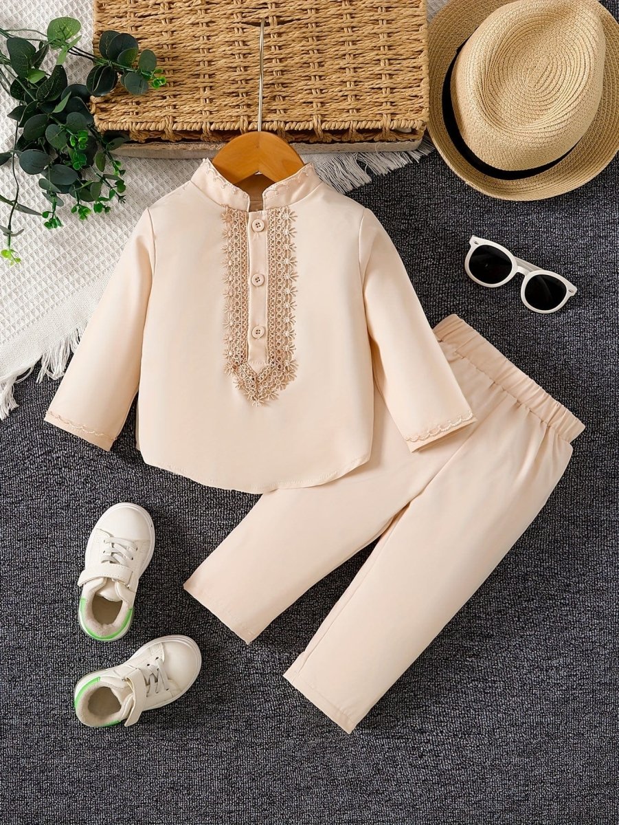 Showlu Fashion boys embroidery shirt and pants 2-piece toddler outfit, classic and trendy for spring and fall, displayed on a child.