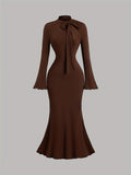 SHOWLU FASHION women's long-sleeve high neck mermaid bodycon dress displayed on a model, showcasing its fitted silhouette and elegant design.