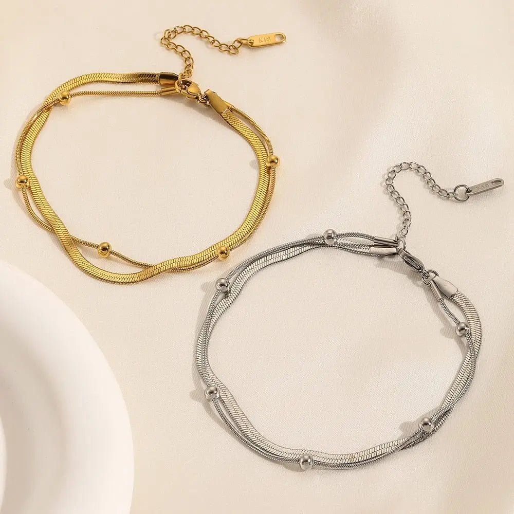 Gold stainless steel double-layer anklet for women, waterproof leg chain with trendy design and jewelry appeal.