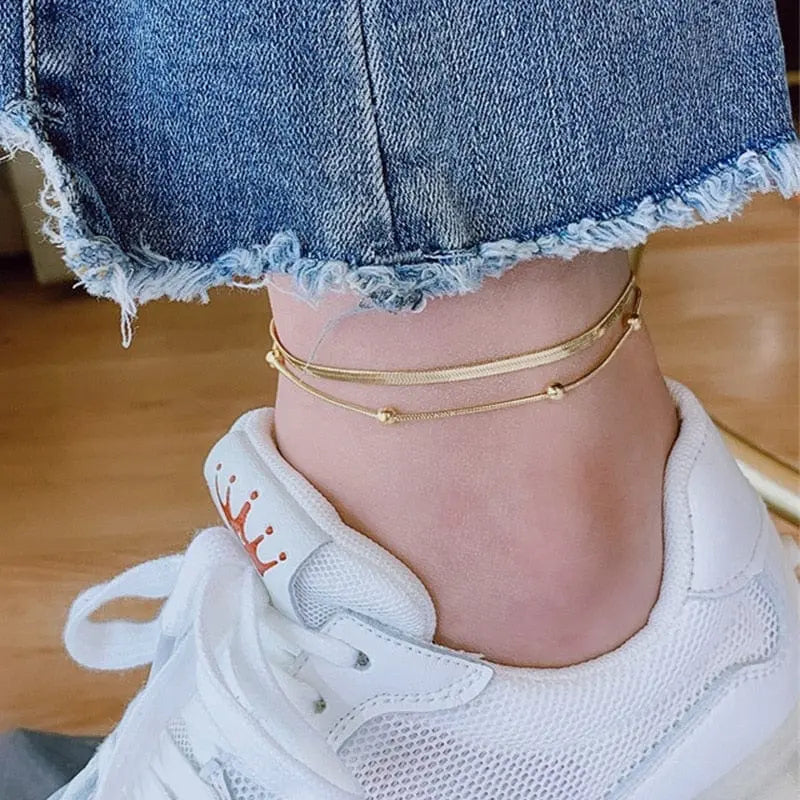 Gold stainless steel double-layer anklet for women, waterproof leg chain with trendy design, ideal for stylish jewelry and parties.