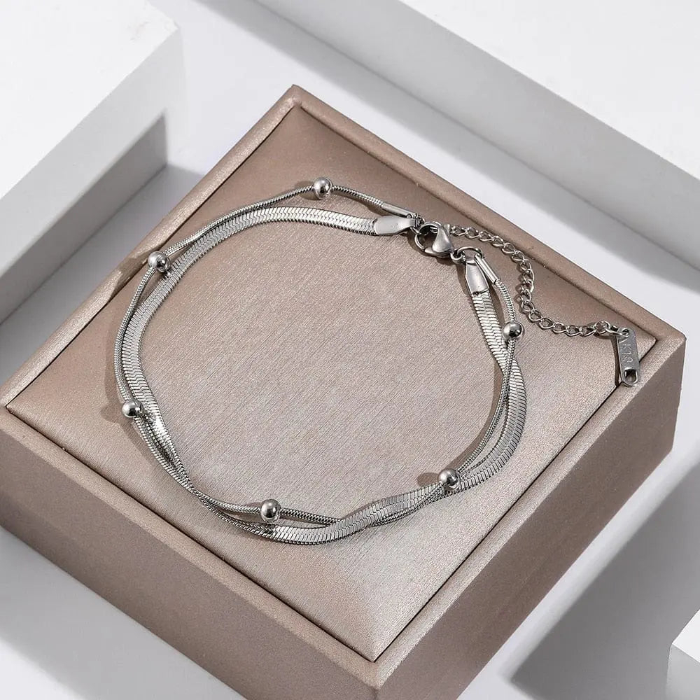 Gold stainless steel double-layer anklet for women, waterproof leg chain with trendy design and elegant appearance.