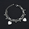 Showlu Fashion Gold Heart Bracelet with layered stainless steel design, rustproof and stylish for women's wrist jewelry.