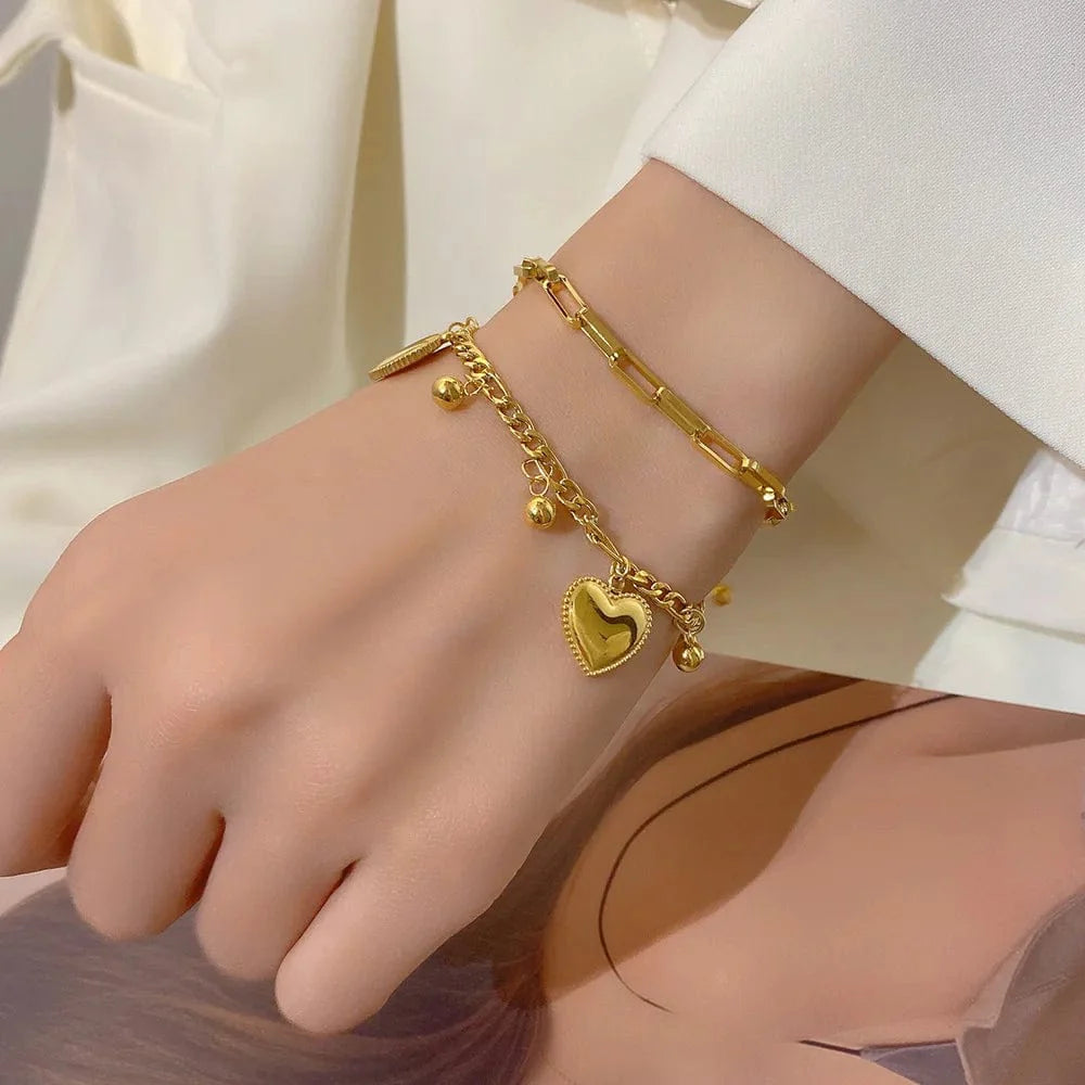 Gold-colored Ramos Gold Heart Bracelet by Showlu Fashion, stainless steel multilayer jewelry with love heart charms for women.